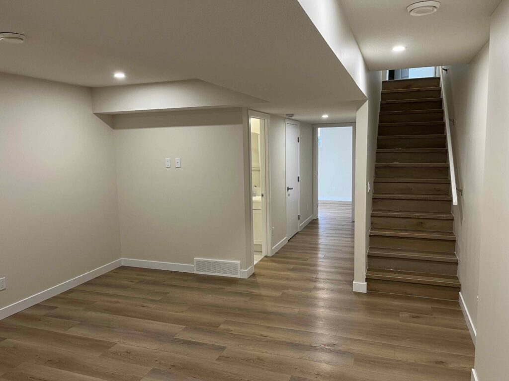 Basement Renovation in Calgary, showing renovated stairs and living room.
